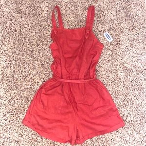 This romper is from old navy kids, it is a pretty dark rosy color, size XL.